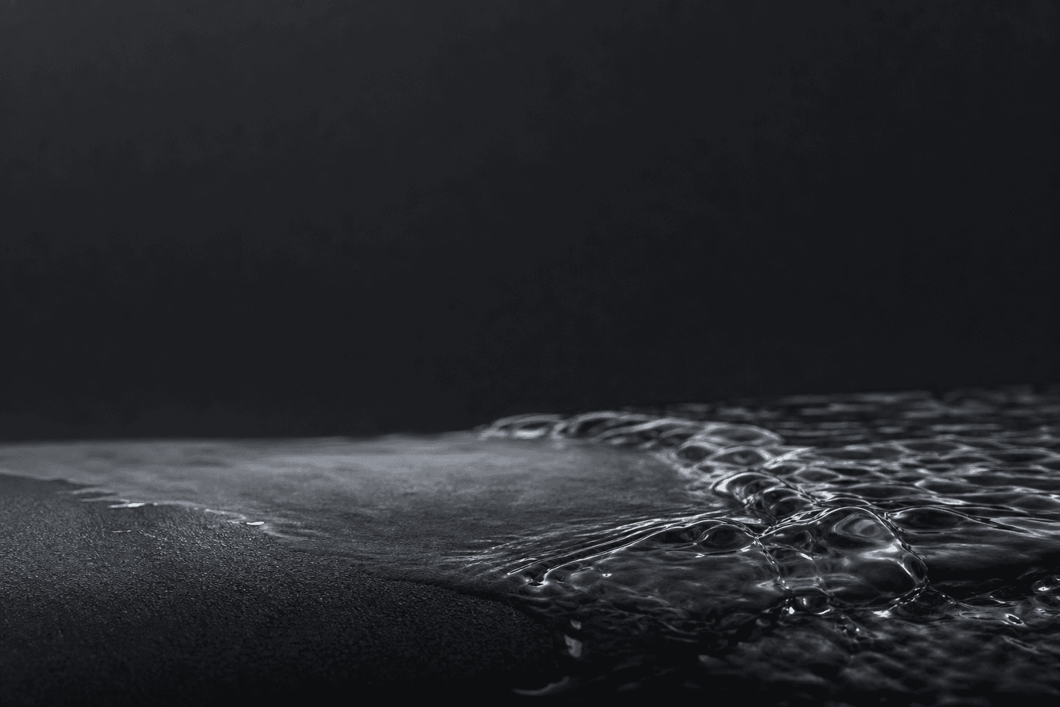 Water moving across a dark surface