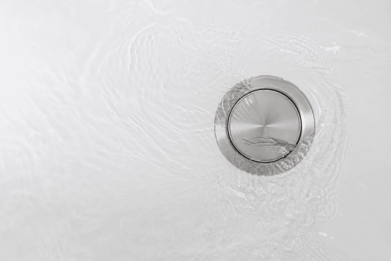 Water draining through a modern fixture
